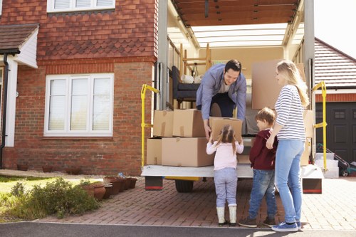 Removal team preparing household items for a UK move