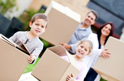 Professional movers loading furniture for an urgent Hanwell removal